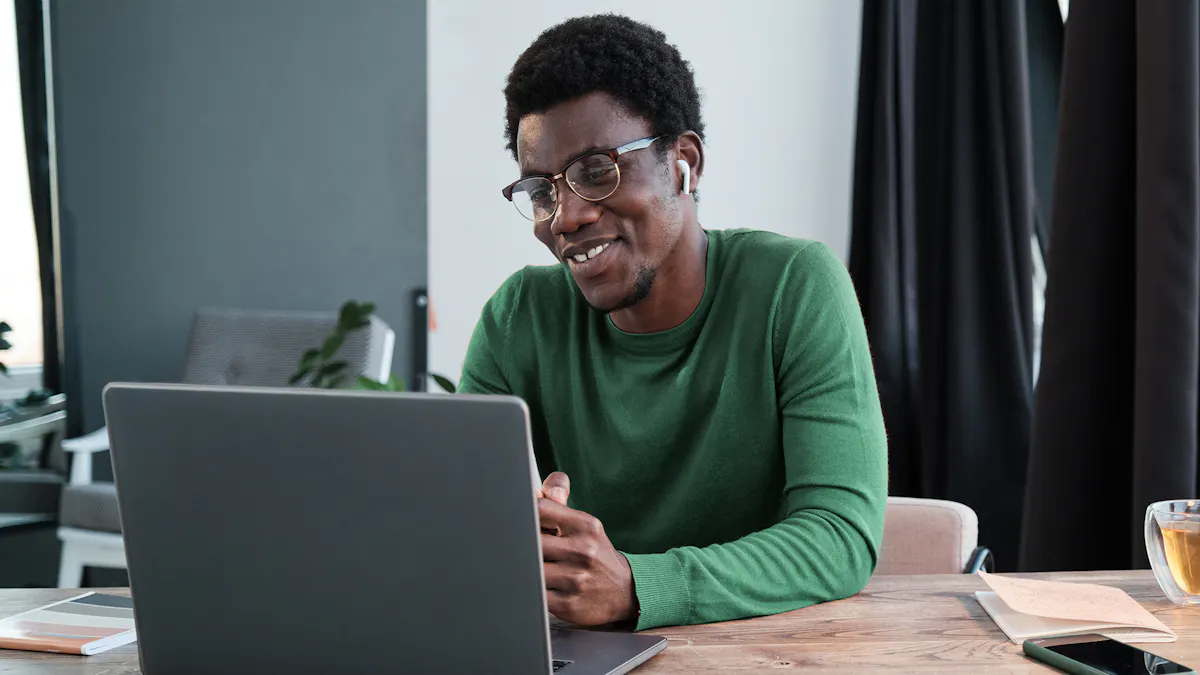 employee working from home smiling at computer