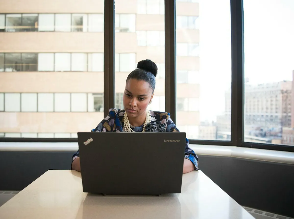 Black woman working in conference room