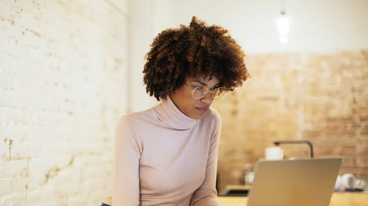 Woman staring intently at code