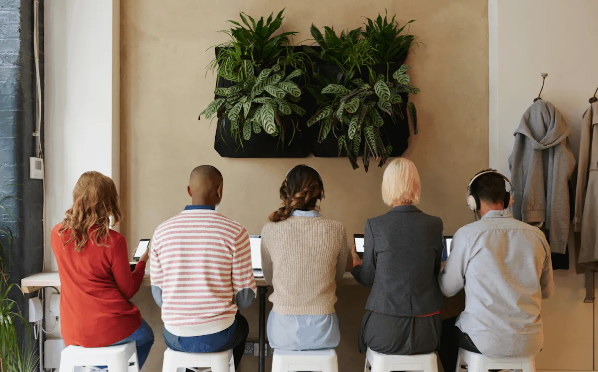 Backside of group stitting on stools