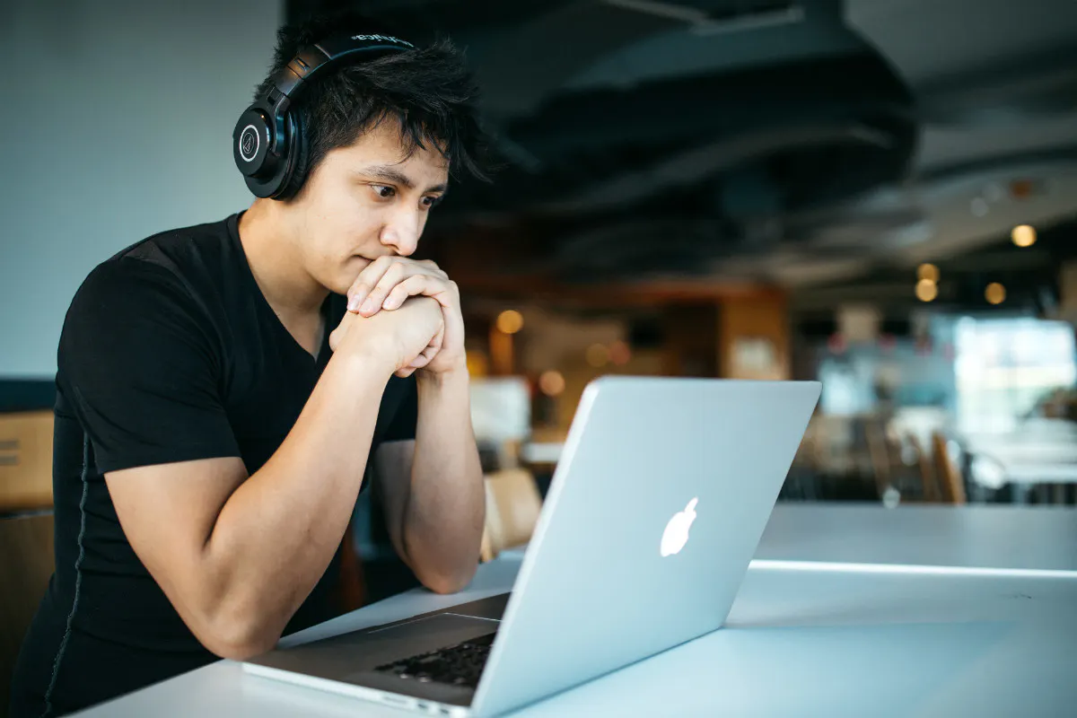 Man at laptop, representing a way one might work in media