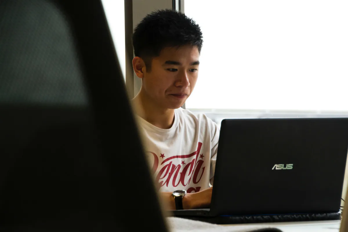 Man at laptop, planning a career change