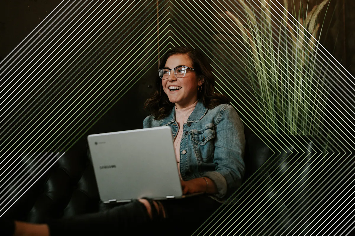 Woman laughing with laptop with pattern