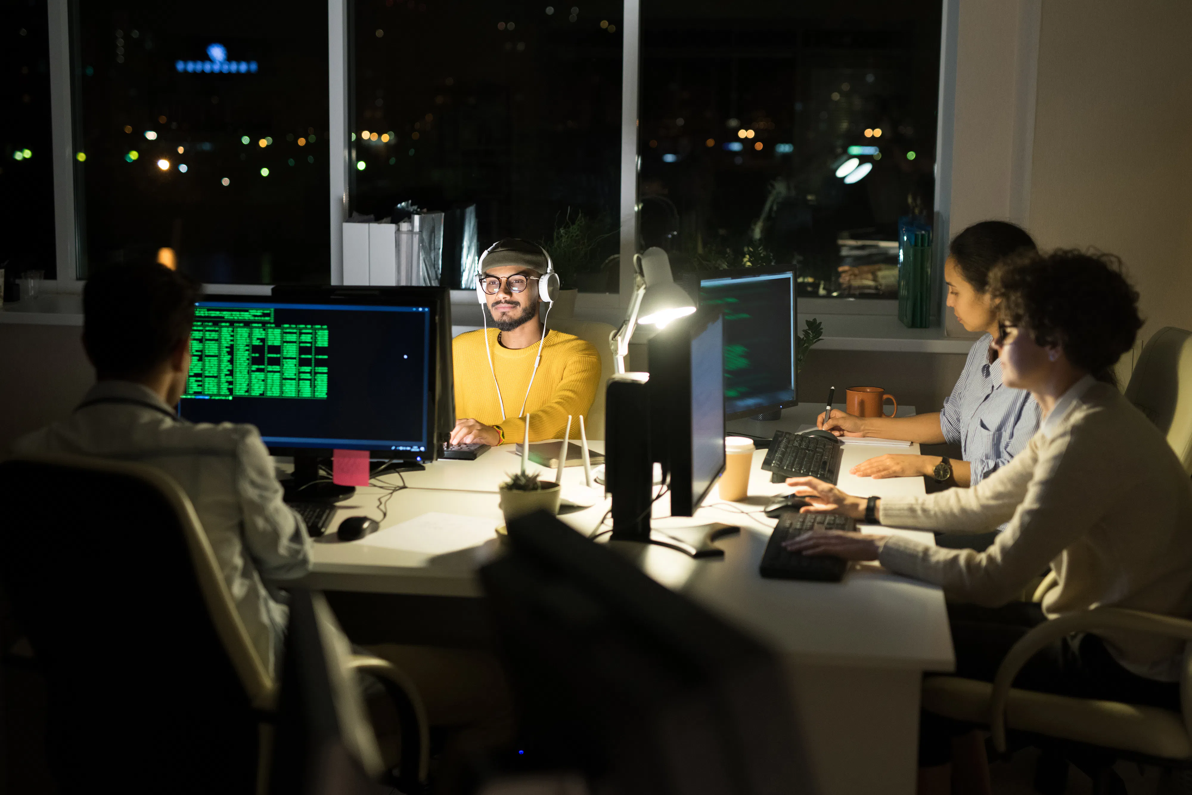Group of cybersecurity professionals at night