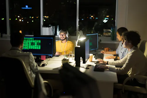 Group of cybersecurity professionals at night