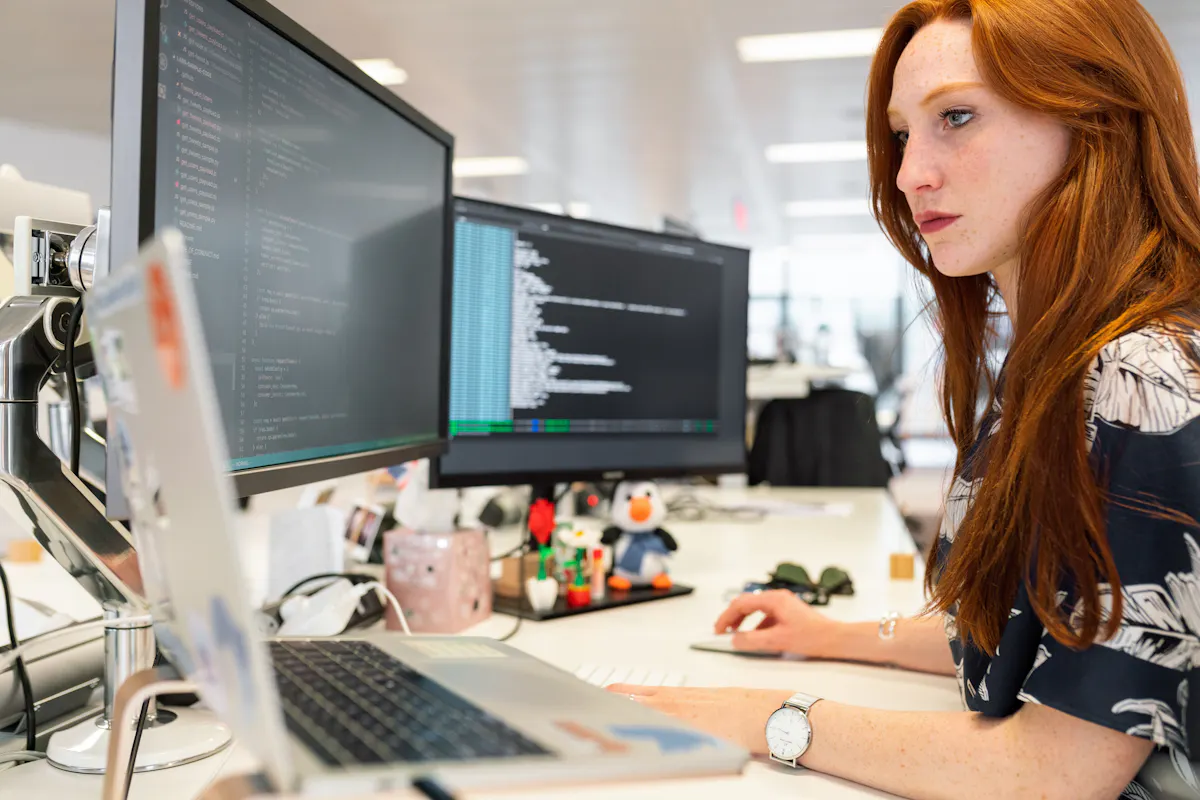 Woman working on code in office
