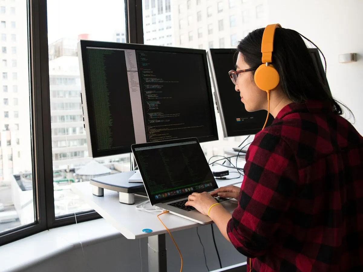 Asian woman working on code