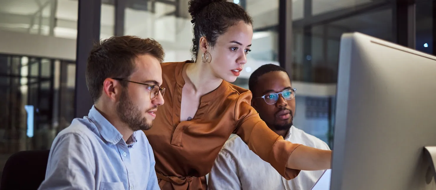 Software engineers working at computer card