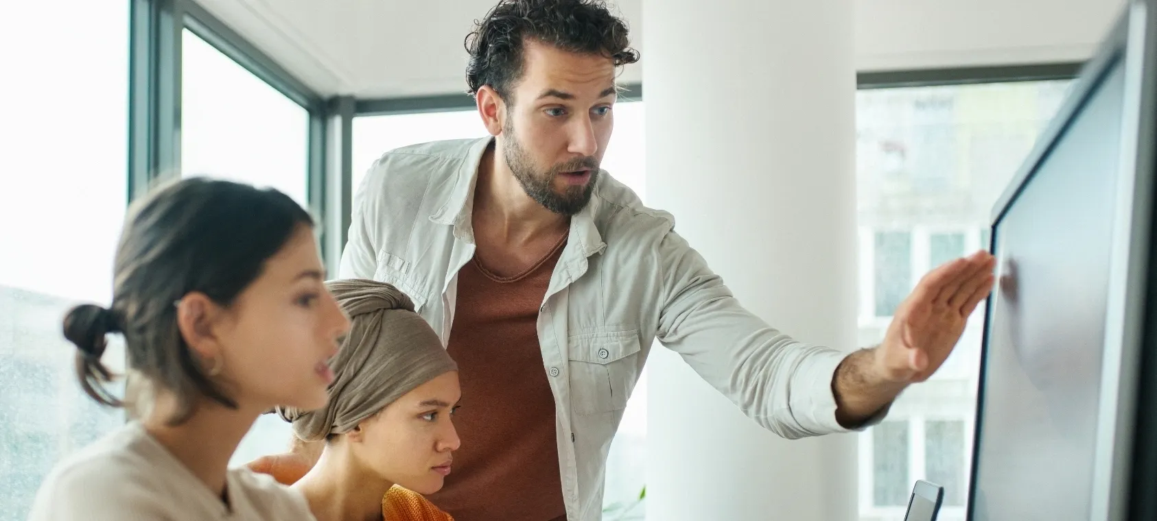 Group looking at monitor card