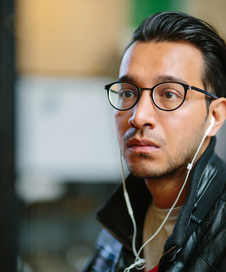 Man with glasses headphones