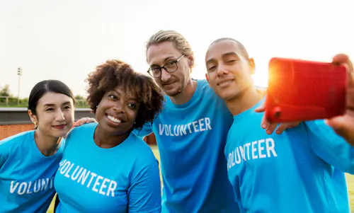 Team of nonprofit volunteers taking a selfie