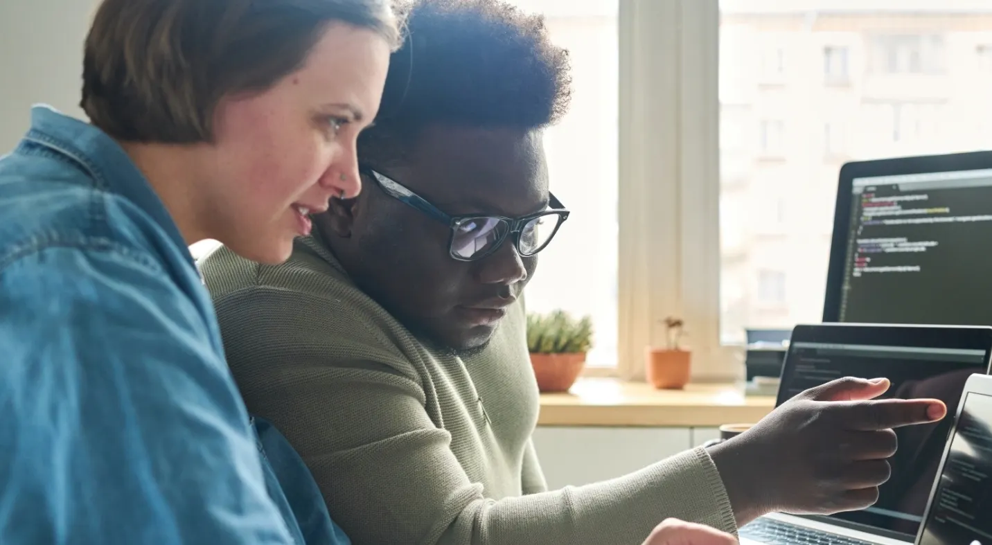 Woman and man looking at AI problem together card