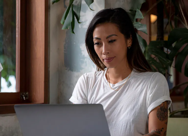 Woman focused at laptop small
